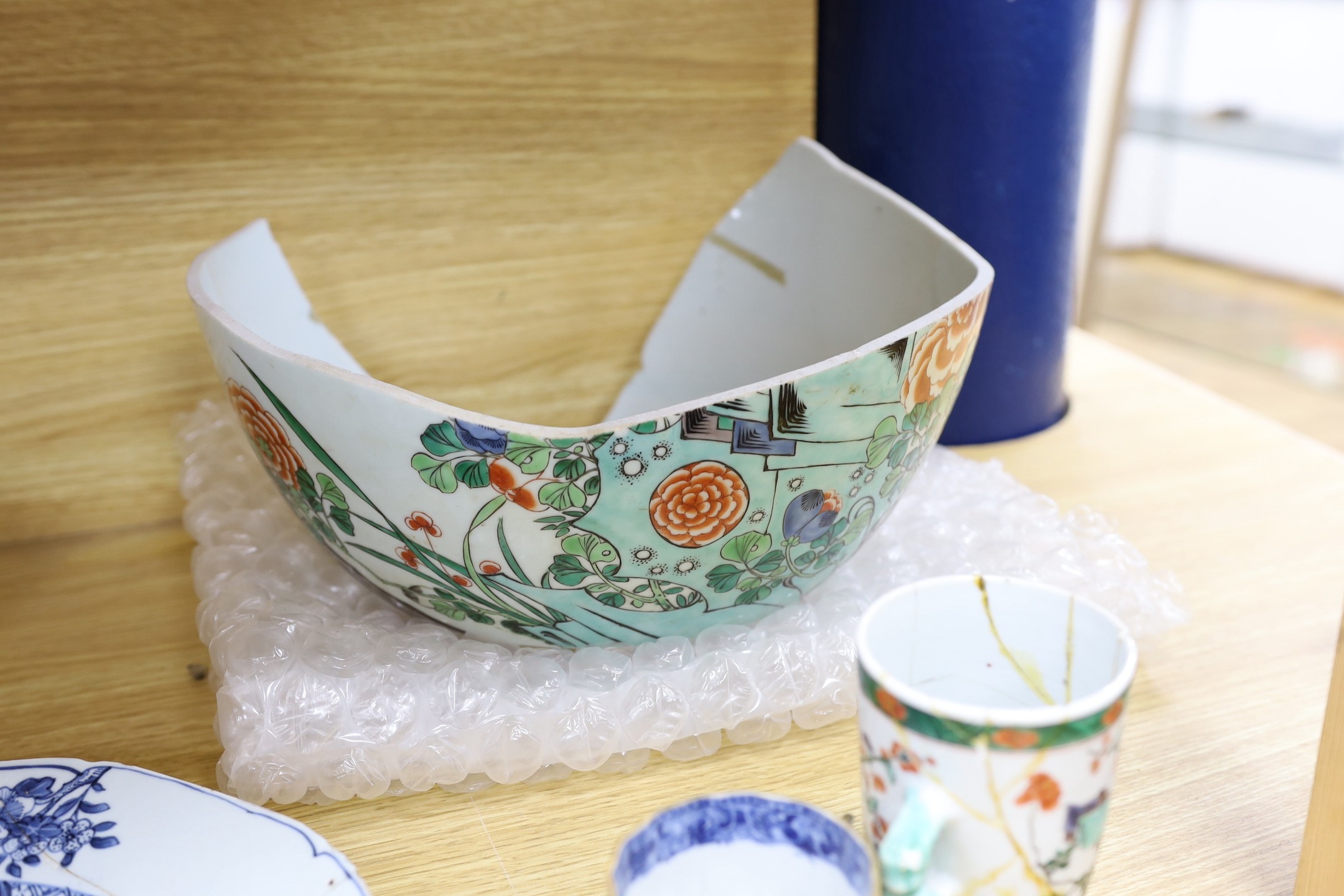 A pair of Chinese Kangxi famille verte cups, together with a large 18th century blue and white plate, and other mixed Chinese porcelain tea wares, including cups, and tea bowls